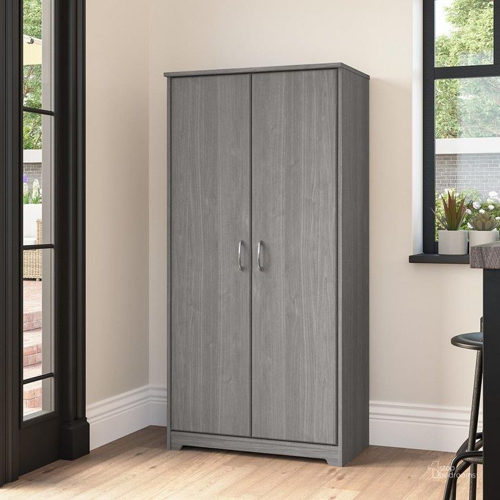 The appearance of Bush Furniture Cabot Tall Kitchen Pantry Cabinet with Doors in Modern Gray designed by Bush Furniture in the modern / contemporary interior design. This gray piece of furniture  was selected by 1StopBedrooms from Cabot Collection to add a touch of cosiness and style into your home. Sku: WC31399-Z. Product Type: Cabinet. Image1