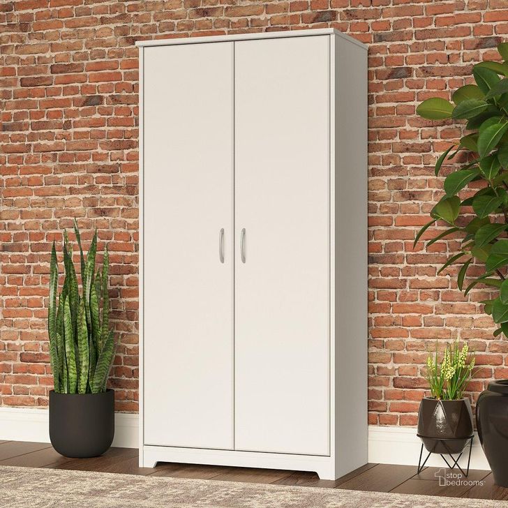 The appearance of Bush Furniture Cabot Tall Storage Cabinet with Doors in White designed by Bush Furniture in the modern / contemporary interior design. This white piece of furniture  was selected by 1StopBedrooms from Cabot Collection to add a touch of cosiness and style into your home. Sku: WC31999. Product Type: Storage Cabinet. Image1