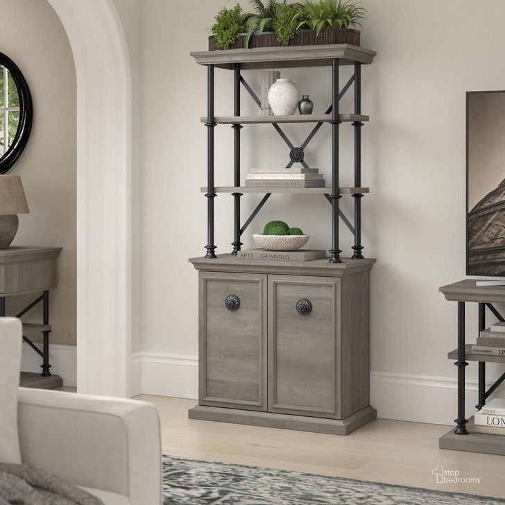 The appearance of Bush Furniture Coliseum Designer Bookcase with Doors in Driftwood Gray designed by Bush Furniture in the country / farmhouse interior design. This gray piece of furniture  was selected by 1StopBedrooms from Coliseum Collection to add a touch of cosiness and style into your home. Sku: CSB169DG-03. Material: Wood. Product Type: Bookcase. Image1