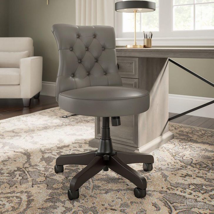 The appearance of Bush Furniture Coliseum Mid Back Tufted Office Chair in Driftwood Gray designed by Bush Furniture in the country / farmhouse interior design. This washed grey piece of furniture  was selected by 1StopBedrooms from Coliseum Collection to add a touch of cosiness and style into your home. Sku: CSMCH2301WGL-Z. Material: Leather. Product Type: Office Chair. Image1