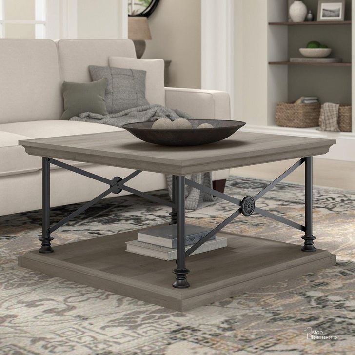 The appearance of Bush Furniture Coliseum Square Coffee Table in Driftwood Gray designed by Bush Furniture in the country / farmhouse interior design. This gray piece of furniture  was selected by 1StopBedrooms from Coliseum Collection to add a touch of cosiness and style into your home. Sku: CST136DG-03. Material: Wood. Product Type: Coffee Table. Image1