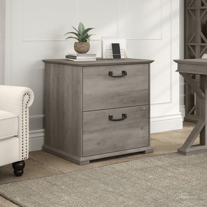 The appearance of Bush Furniture Homestead Farmhouse Lateral File Cabinet in Driftwood Gray designed by Bush Furniture in the country / farmhouse interior design. This gray piece of furniture  was selected by 1StopBedrooms from Homestead Collection to add a touch of cosiness and style into your home. Sku: HOF129DG-03. Material: Wood. Product Type: Lateral Filing Cabinet. Image1