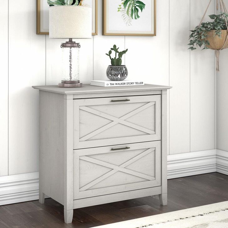 The appearance of Bush Furniture Key West 2 Drawer Lateral File Cabinet In Linen White Oak designed by Bush Furniture in the country / farmhouse interior design. This linen white piece of furniture  was selected by 1StopBedrooms from Key West Collection to add a touch of cosiness and style into your home. Sku: KWF130LW-03. Product Type: File Cabinet. Image1