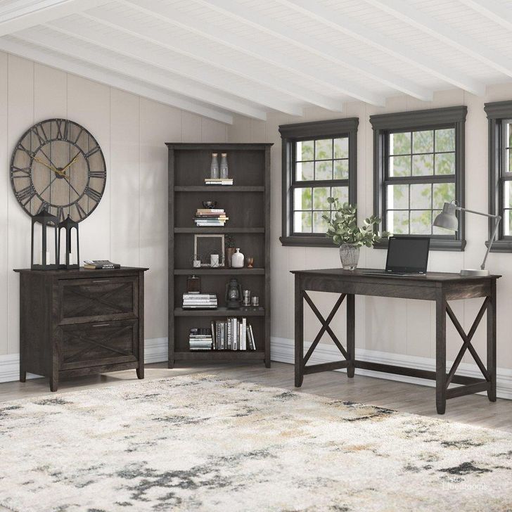 The appearance of Bush Furniture Key West 48W Writing Desk With 2 Drawer Lateral File Cabinet And 5 Shelf Bookcase In Dark Gray Hickory designed by Bush Furniture in the country / farmhouse interior design. This dark gray piece of furniture  was selected by 1StopBedrooms from Key West Collection to add a touch of cosiness and style into your home. Sku: KWS004GH. Product Type: Home Office Desk. Image1