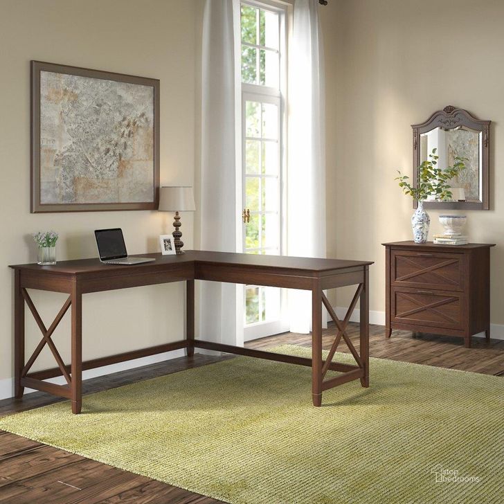 The appearance of Bush Furniture Key West 60W L Shaped Desk With 2 Drawer Lateral File Cabinet In Bing Cherry designed by Bush Furniture in the country / farmhouse interior design. This cherry piece of furniture  was selected by 1StopBedrooms from Key West Collection to add a touch of cosiness and style into your home. Sku: KWS014BC. Product Type: Home Office Desk. Image1