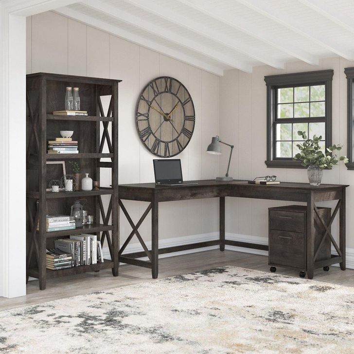 The appearance of Bush Furniture Key West 60W L Shaped Desk With 2 Drawer Mobile File Cabinet And 5 Shelf Bookcase In Dark Gray Hickory designed by Bush Furniture in the country / farmhouse interior design. This dark gray piece of furniture  was selected by 1StopBedrooms from Key West Collection to add a touch of cosiness and style into your home. Sku: KWS016GH. Product Type: Home Office Desk. Image1