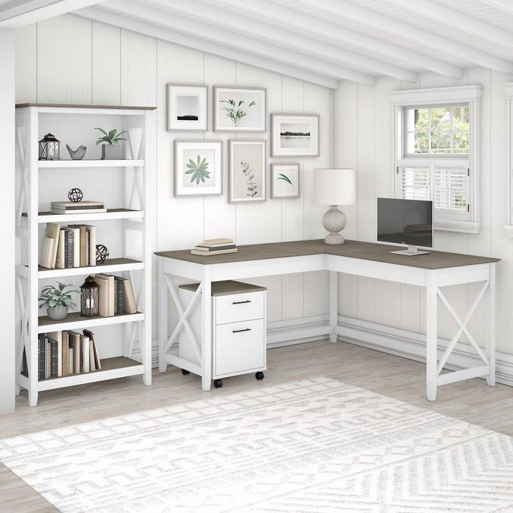 The appearance of Bush Furniture Key West 60W L Shaped Desk With 2 Drawer Mobile File Cabinet And 5 Shelf Bookcase In Pure White And Shiplap Gray designed by Bush Furniture in the country / farmhouse interior design. This white and gray piece of furniture  was selected by 1StopBedrooms from Key West Collection to add a touch of cosiness and style into your home. Sku: KWS016G2W. Product Type: Home Office Desk. Image1