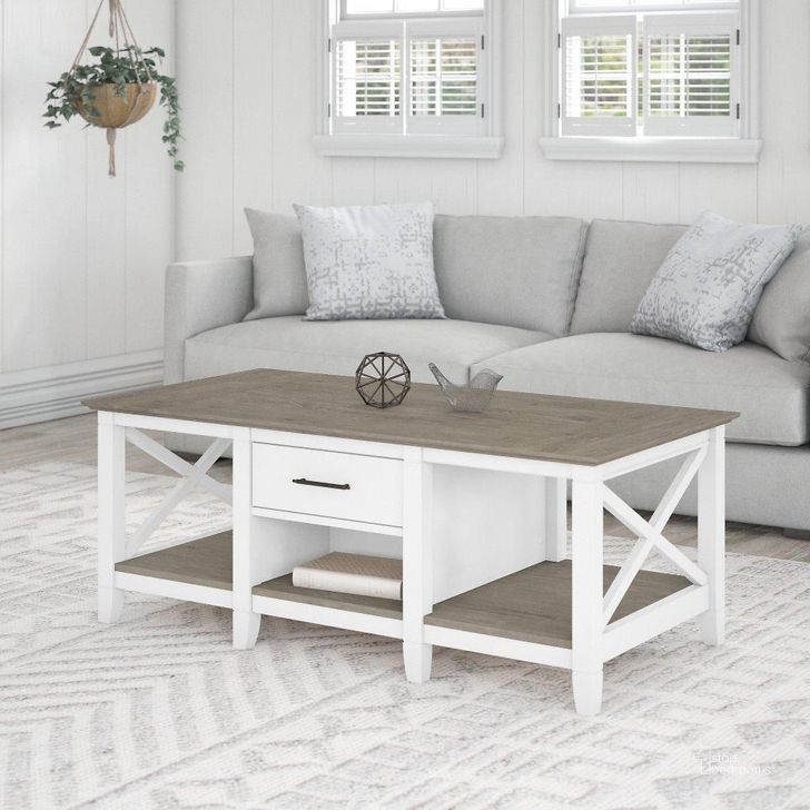 The appearance of Bush Furniture Key West Coffee Table With Storage In Pure White And Shiplap Gray designed by Bush Furniture in the country / farmhouse interior design. This white and gray piece of furniture  was selected by 1StopBedrooms from Key West Collection to add a touch of cosiness and style into your home. Sku: KWT148G2W-03. Product Type: Coffee Table. Image1