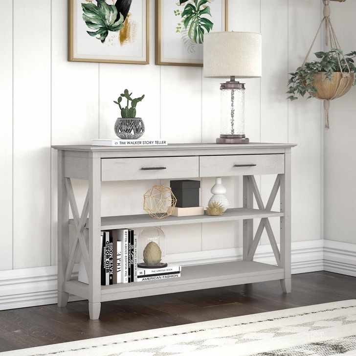 The appearance of Bush Furniture Key West Console Table With Drawers And Shelves In Linen White Oak designed by Bush Furniture in the country / farmhouse interior design. This linen white piece of furniture  was selected by 1StopBedrooms from Key West Collection to add a touch of cosiness and style into your home. Sku: KWT248LW-03. Product Type: Console Table. Image1