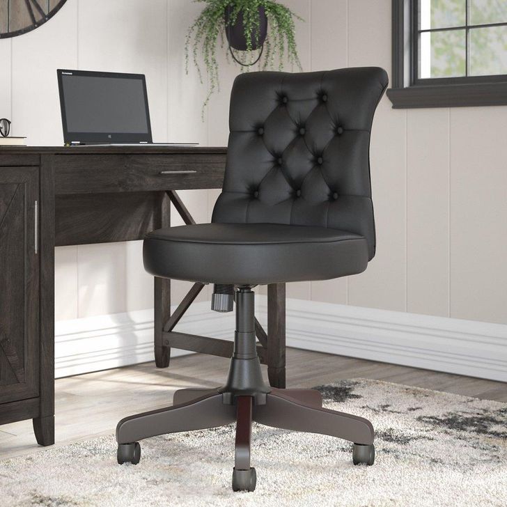 The appearance of Bush Furniture Key West Mid Back Tufted Office Chair in Black Leather designed by Bush Furniture in the country / farmhouse interior design. This black leather piece of furniture  was selected by 1StopBedrooms from Key West Collection to add a touch of cosiness and style into your home. Sku: KWS019BL. Material: Wood. Product Type: Office Chair. Image1