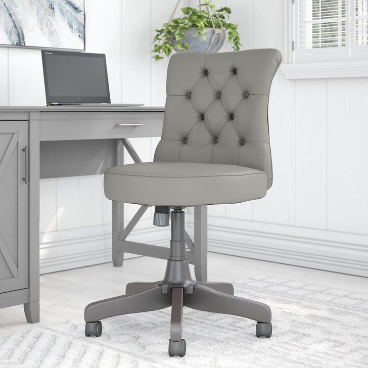 The appearance of Bush Furniture Key West Mid Back Tufted Office Chair in Light Gray Leather designed by Bush Furniture in the country / farmhouse interior design. This grey leather piece of furniture  was selected by 1StopBedrooms from Key West Collection to add a touch of cosiness and style into your home. Sku: KWS019LGL. Material: Wood. Product Type: Office Chair. Image1