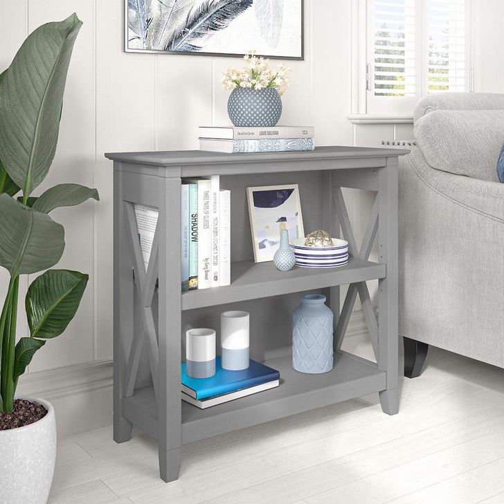 The appearance of Bush Furniture Key West Small 2 Shelf Bookcase In Cape Cod Gray designed by Bush Furniture in the country / farmhouse interior design. This gray piece of furniture  was selected by 1StopBedrooms from Key West Collection to add a touch of cosiness and style into your home. Sku: KWB124CG-03. Product Type: Bookcase. Image1