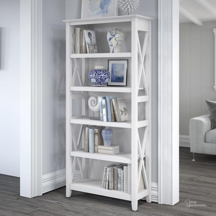 The appearance of Bush Furniture Key West Tall 5 Shelf Bookcase In Pure White Oak designed by Bush Furniture in the country / farmhouse interior design. This white piece of furniture  was selected by 1StopBedrooms from Key West Collection to add a touch of cosiness and style into your home. Sku: KWB132WT-03. Product Type: Bookcase. Image1