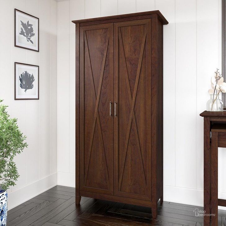 The appearance of Bush Furniture Key West Tall Storage Cabinet With Doors In Bing Cherry designed by Bush Furniture in the country / farmhouse interior design. This cherry piece of furniture  was selected by 1StopBedrooms from Key West Collection to add a touch of cosiness and style into your home. Sku: KWS266BC-03. Product Type: Storage Cabinet. Image1