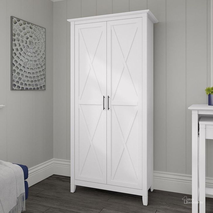 The appearance of Bush Furniture Key West Tall Storage Cabinet With Doors In Pure White Oak designed by Bush Furniture in the country / farmhouse interior design. This white piece of furniture  was selected by 1StopBedrooms from Key West Collection to add a touch of cosiness and style into your home. Sku: KWS266WT-03. Product Type: Storage Cabinet. Image1
