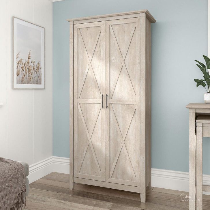 The appearance of Bush Furniture Key West Tall Storage Cabinet with Doors in Washed Gray designed by Bush Furniture in the country / farmhouse interior design. This washed grey piece of furniture  was selected by 1StopBedrooms from Key West Collection to add a touch of cosiness and style into your home. Sku: KWS266WG-03. Product Type: Storage Cabinet. Image1