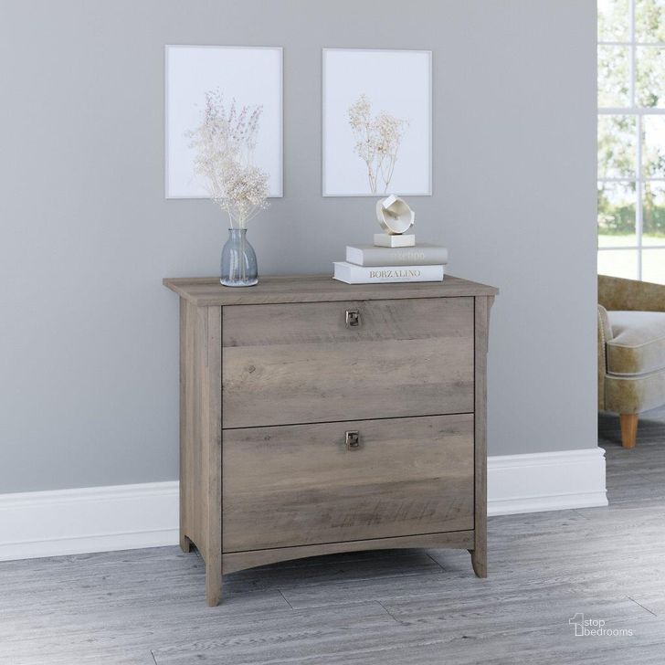 The appearance of Bush Furniture Salinas 2 Drawer Lateral File Cabinet in Driftwood Gray designed by Bush Furniture in the country / farmhouse interior design. This gray piece of furniture  was selected by 1StopBedrooms from Salinas Collection to add a touch of cosiness and style into your home. Sku: SAF132DG-03. Product Type: Lateral Filing Cabinet. Image1