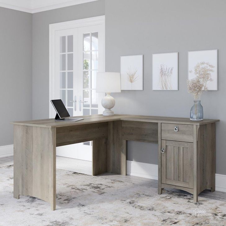 The appearance of Bush Furniture Salinas 60W L Shaped Desk with Storage in Driftwood Gray designed by Bush Furniture in the country / farmhouse interior design. This gray piece of furniture  was selected by 1StopBedrooms from Salinas Collection to add a touch of cosiness and style into your home. Sku: SAD160DG-03. Product Type: Desk. Image1