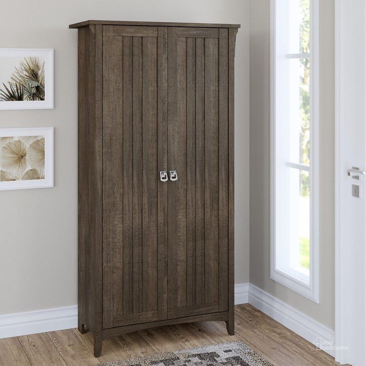The appearance of Bush Furniture Salinas Tall Storage Cabinet with Doors in Ash Brown designed by Bush Furniture in the country / farmhouse interior design. This brown piece of furniture  was selected by 1StopBedrooms from Salinas Collection to add a touch of cosiness and style into your home. Sku: SAS332ABR-03. Product Type: Storage Cabinet. Image1