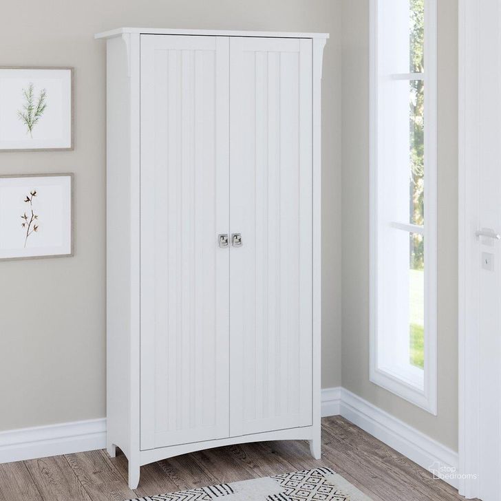 The appearance of Bush Furniture Salinas Tall Storage Cabinet with Doors in Pure White designed by Bush Furniture in the country / farmhouse interior design. This white piece of furniture  was selected by 1StopBedrooms from Salinas Collection to add a touch of cosiness and style into your home. Sku: SAS332G2W-03. Product Type: Storage Cabinet. Image1