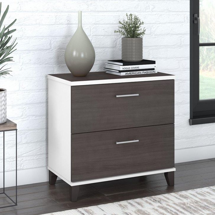 The appearance of Bush Furniture Somerset 2 Drawer Lateral File Cabinet in White and Storm Gray designed by Bush Furniture in the modern / contemporary interior design. This storm gray and white piece of furniture  was selected by 1StopBedrooms from Somerset Collection to add a touch of cosiness and style into your home. Sku: WC81080. Product Type: Lateral Filing Cabinet. Image1