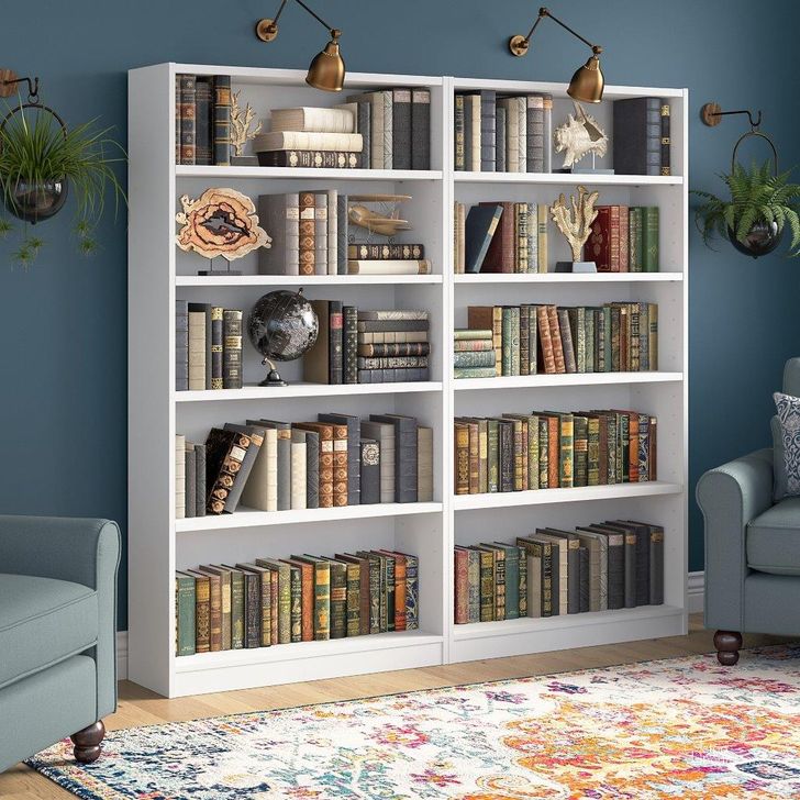 The appearance of Bush Furniture Universal 5 Shelf Bookcase Set Of 2 In Pure White designed by Bush Furniture in the modern / contemporary interior design. This white piece of furniture  was selected by 1StopBedrooms from Universal Collection to add a touch of cosiness and style into your home. Sku: UB003PW. Product Type: Bookcase. Image1
