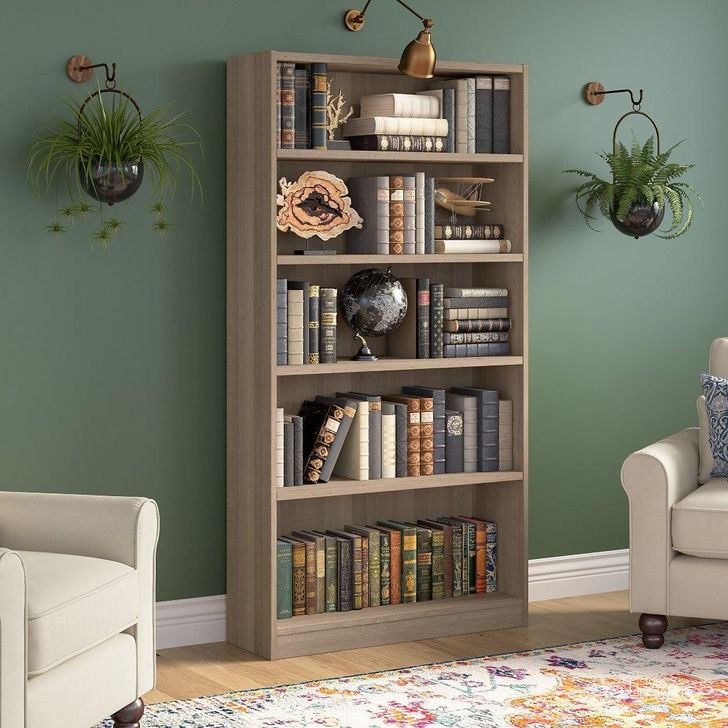 The appearance of Bush Furniture Universal Tall 5 Shelf Bookcase in Ash Gray designed by Bush Furniture in the modern / contemporary interior design. This ash gray piece of furniture  was selected by 1StopBedrooms from Universal Bookcases Collection to add a touch of cosiness and style into your home. Sku: WL12427. Product Type: Bookcase. Image1