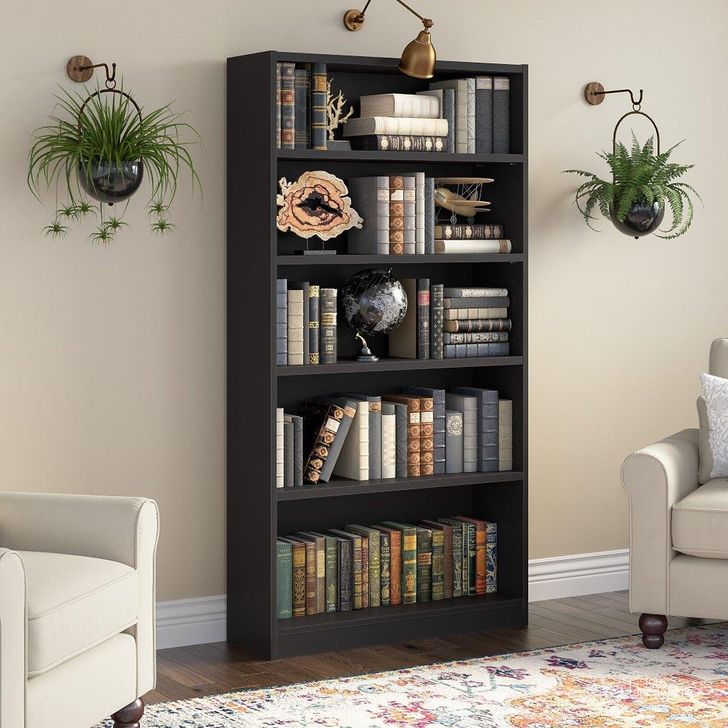 The appearance of Bush Furniture Universal Tall 5 Shelf Bookcase in Black designed by Bush Furniture in the modern / contemporary interior design. This black piece of furniture  was selected by 1StopBedrooms from Universal Bookcases Collection to add a touch of cosiness and style into your home. Sku: WL12436. Product Type: Bookcase. Image1
