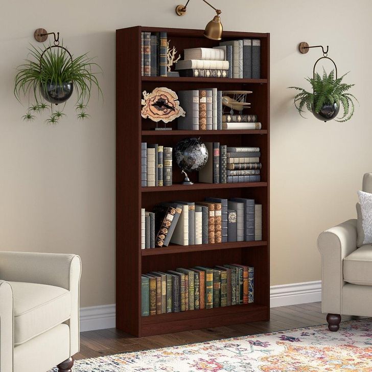The appearance of Bush Furniture Universal Tall 5 Shelf Bookcase in Harvest Cherry designed by Bush Furniture in the traditional interior design. This cherry piece of furniture  was selected by 1StopBedrooms from Universal Bookcases Collection to add a touch of cosiness and style into your home. Sku: WL12439. Product Type: Bookcase. Image1