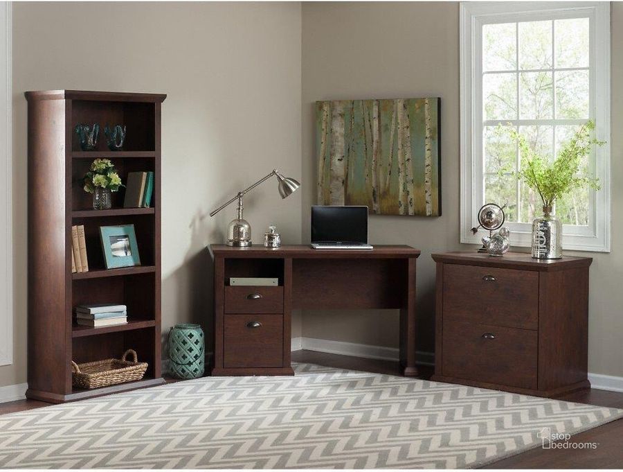 The appearance of Bush Furniture Yorktown 50W Home Office Desk With Lateral File Cabinet And 5 Shelf Bookcase In Antique Cherry designed by Bush Furniture in the country / farmhouse interior design. This antique cherry piece of furniture  was selected by 1StopBedrooms from Yorktown Collection to add a touch of cosiness and style into your home. Sku: YRK011ANC. Product Type: Home Office Desk. Image1