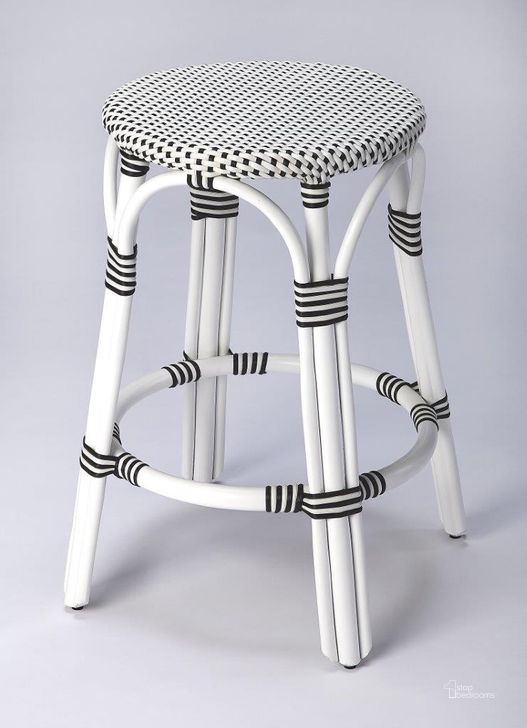 The appearance of Butler Tobias Black and White Rattan Counter Stool 9371288 designed by Butler Specialty Company in the transitional interior design. This black and white piece of furniture  was selected by 1StopBedrooms from Designer's Edge Collection to add a touch of cosiness and style into your home. Sku: 9371288. Material: Rattan. Product Type: Barstool. Image1