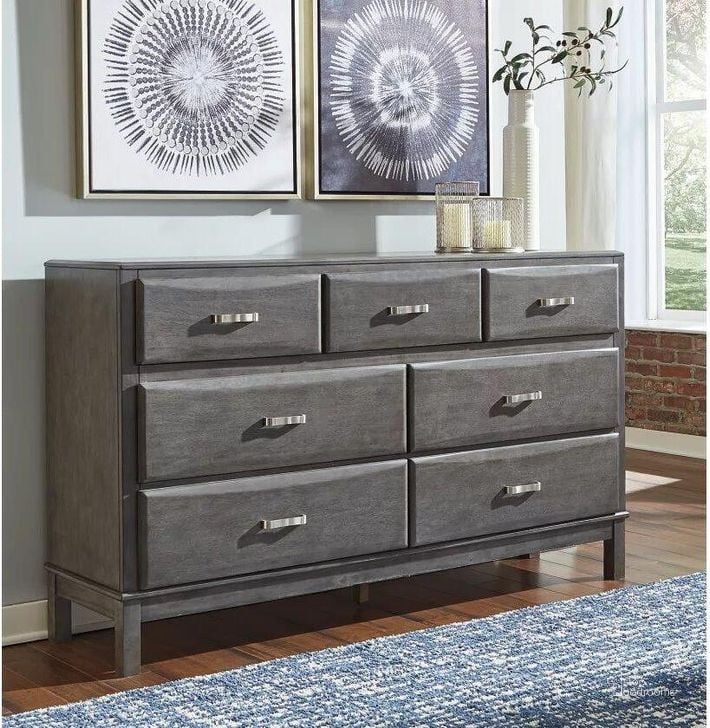 The appearance of Caitbrook Gray Dresser designed by Signature Design by Ashley in the modern / contemporary interior design. This gray piece of furniture  was selected by 1StopBedrooms from Caitbrook Collection to add a touch of cosiness and style into your home. Sku: B476-31. Material: Wood. Product Type: Dresser. Image1