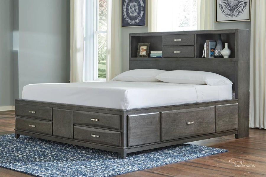The appearance of Caitbrook Gray Queen Storage Panel Bed designed by Signature Design by Ashley in the modern / contemporary interior design. This gray piece of furniture  was selected by 1StopBedrooms from Caitbrook Collection to add a touch of cosiness and style into your home. Sku: B476-65;B476-64;B476-98. Bed Type: Storage Bed. Material: Wood. Product Type: Storage Bed. Bed Size: Queen. Image1