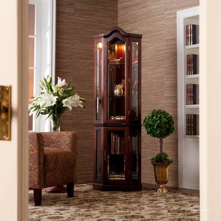 The appearance of Canterdale Lighted Corner Curio Cabinet In Mahogany designed by SEI Furniture in the traditional interior design. This mahogany piece of furniture  was selected by 1StopBedrooms from Canterdale Collection to add a touch of cosiness and style into your home. Sku: CM0696. Product Type: Curio Cabinet. Material: Rubberwood. Image1