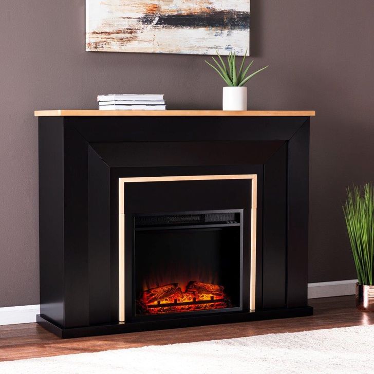 The appearance of Cardington Industrial Base Electric Fireplace designed by SEI Furniture in the industrial interior design. This black piece of furniture  was selected by 1StopBedrooms from Cardington Collection to add a touch of cosiness and style into your home. Sku: FP1095859. Material: Wood. Product Type: Fireplace. Image1