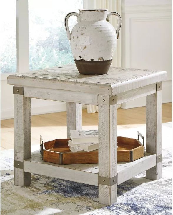 The appearance of Carynhurst White Rectangular End Table designed by Signature Design by Ashley in the transitional interior design. This white wash gray piece of furniture  was selected by 1StopBedrooms from Carynhurst Collection to add a touch of cosiness and style into your home. Sku: T757-3. Material: Metal. Product Type: End Table. Image1