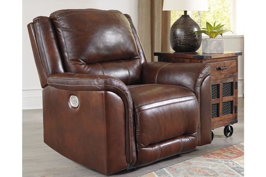 The appearance of Catanzaro Power Recliner with Adjustable Headrest In Mahogany designed by Signature Design by Ashley in the traditional interior design. This mahogany piece of furniture  was selected by 1StopBedrooms from Catanzaro Collection to add a touch of cosiness and style into your home. Sku: U8300413. Product Type: Recliner. Material: Leather Match. Image1
