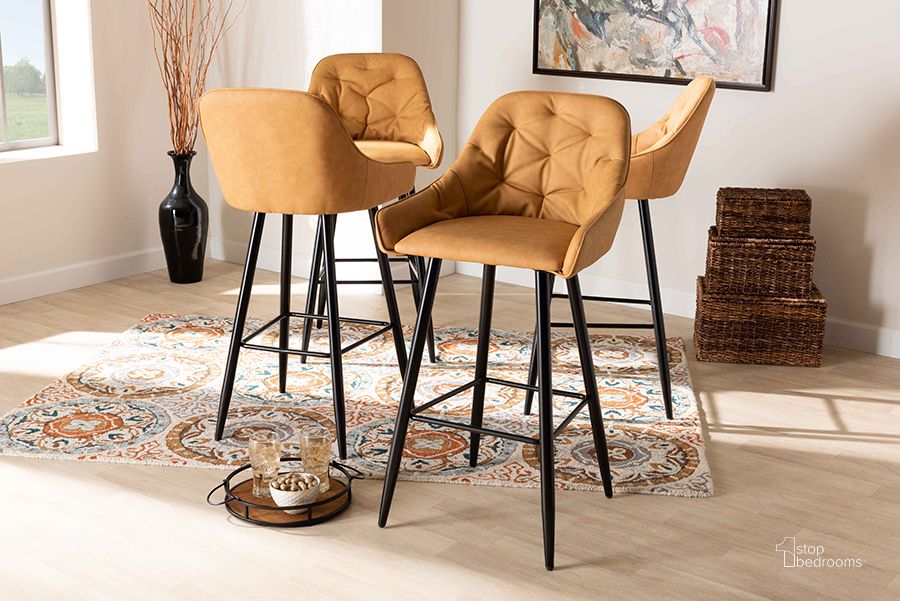 The appearance of Catherine Modern and Contemporary Tan Faux Leather Upholstered and Black Metal 4-Piece Bar Stool Set designed by Baxton Studio in the modern / contemporary interior design. This tan piece of furniture  was selected by 1StopBedrooms from Catherine Collection to add a touch of cosiness and style into your home. Sku: BA-9-Tan/Black-BS. Material: Leather. Product Type: Barstool. Image1
