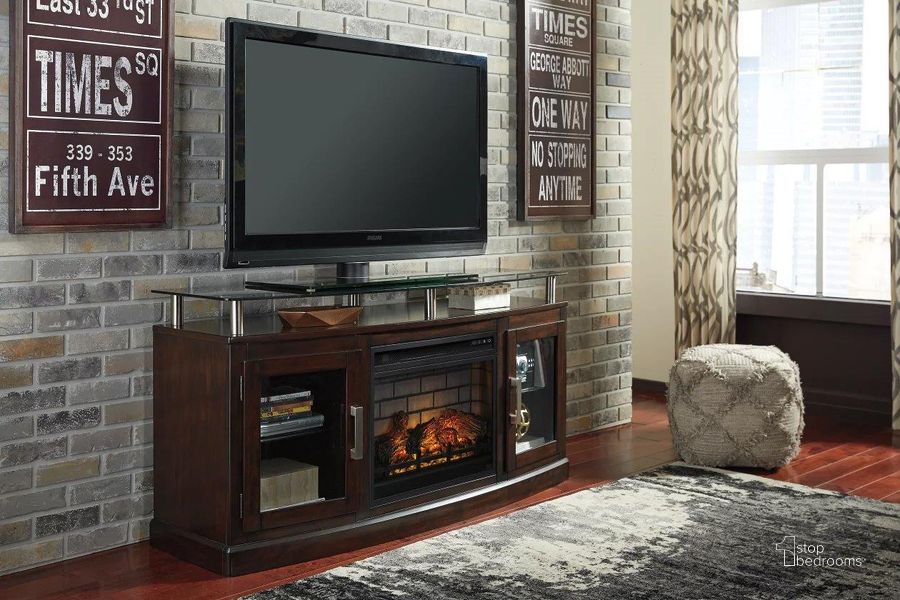 The appearance of Chanceen Dark Brown 60" TV Stand with Electric Fireplace designed by Signature Design by Ashley in the modern / contemporary interior design. This dark brown piece of furniture  was selected by 1StopBedrooms from Chanceen Collection to add a touch of cosiness and style into your home. Sku: W757-48;W100-101. Material: Glass. Product Type: TV Stands and TV Console. Image1
