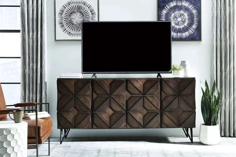 The appearance of Chasinfield Dark Brown Extra Large TV Stand designed by Signature Design by Ashley in the modern / contemporary interior design. This dark brown piece of furniture  was selected by 1StopBedrooms from Chasinfield Collection to add a touch of cosiness and style into your home. Sku: W648-68. Material: Wood. Product Type: TV Stand. Image1