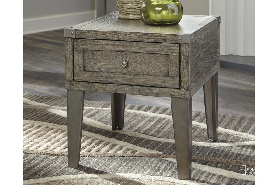 The appearance of Chazney Rustic Brown Rectangular End Table designed by Signature Design by Ashley in the modern / contemporary interior design. This rustic brown piece of furniture  was selected by 1StopBedrooms from Chazney Collection to add a touch of cosiness and style into your home. Sku: T904-3. Material: Metal. Product Type: End Table. Image1