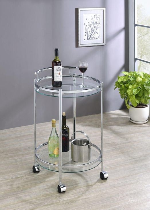 The appearance of Chrissy Round Glass Bar Cart Chrome designed by Coaster in the modern / contemporary interior design. This chrome piece of furniture  was selected by 1StopBedrooms from Chrissy Collection to add a touch of cosiness and style into your home. Sku: 181367. Material: Glass. Product Type: Bar Cart. Image1
