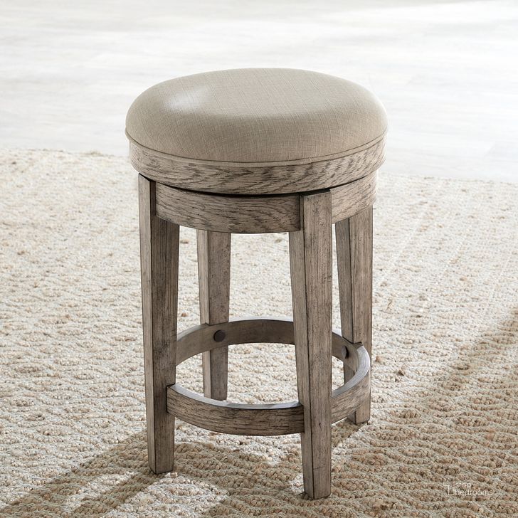 The appearance of City Scape Upholstered Swivel Console Stool In Burnished Beige designed by Liberty in the modern / contemporary interior design. This beige piece of furniture  was selected by 1StopBedrooms from City Scape Collection to add a touch of cosiness and style into your home. Sku: 421-OT9003. Product Type: Barstool. Material: Poplar. Image1