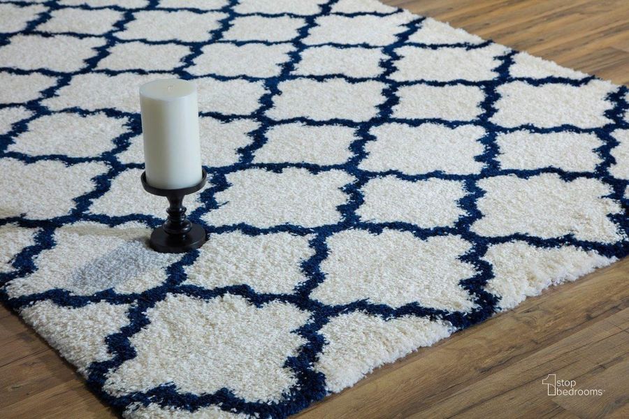The appearance of Cloud Shag FH100C Ivory Navy Quatrefoil Geometric Contemporary Ivory 5' x 8' Area Rug designed by Rugs America in the modern / contemporary interior design. This ivory piece of furniture  was selected by 1StopBedrooms from Cloud Shag Collection to add a touch of cosiness and style into your home. Sku: RA26334. Material: Polypropylene. Product Type: Area Rugs. Image1