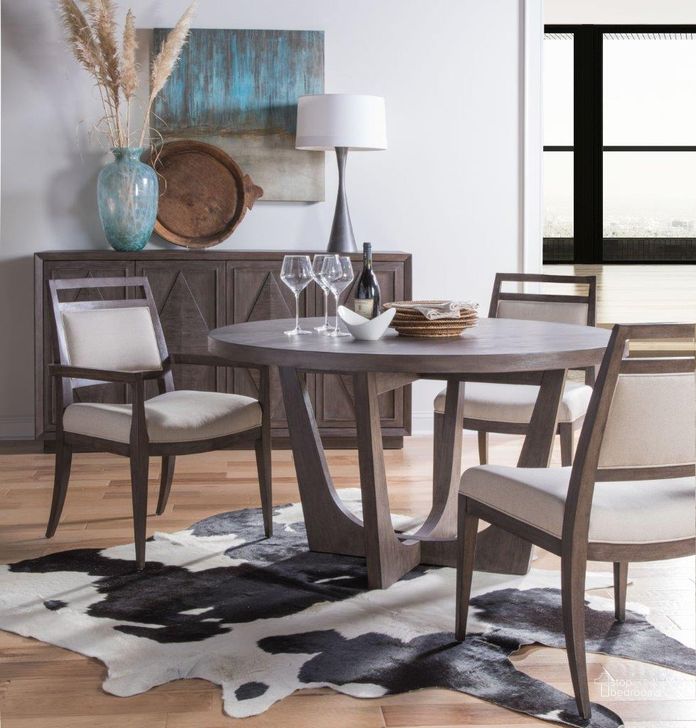The appearance of Cohesion Program Brown Brio Round Dining Room Set designed by Artistica Home in the transitional interior design. This brown piece of furniture  was selected by 1StopBedrooms from Cohesion Program Collection to add a touch of cosiness and style into your home. Sku: 01-2058-870-39;01-2222-880-39-01. Table Base Style: Trestle. Table Top Shape: Round. Product Type: Dining Room Set. Size: 54". Image1