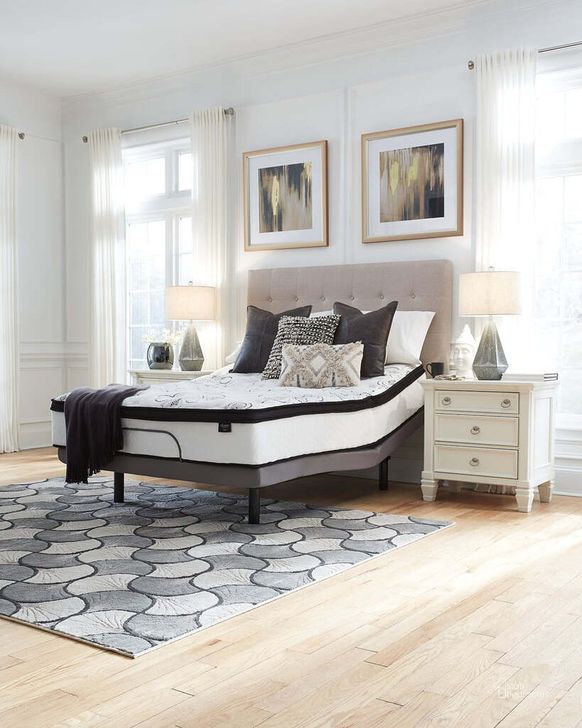 The appearance of Contemporary Queen Upholstered Panel Bed With Chime 10" Hybrid Plush Bed In A Box Mattress designed by Signature Design by Ashley in the modern / contemporary interior design. This gray piece of furniture  was selected by 1StopBedrooms from Contemporary Collection to add a touch of cosiness and style into your home. Sku: B130-381;M91X32;M69631. Bed Type: Panel Bed. Material: Fabric. Product Type: Panel Bed. Bed Size: Queen. Image1