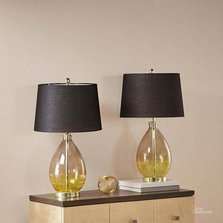 The appearance of Cortina Glass Table Lamp Set Of 2 In Gold designed by Olliix in the transitional interior design. This gold piece of furniture  was selected by 1StopBedrooms from Cortina Collection to add a touch of cosiness and style into your home. Sku: 5DS153-1158. Material: Polyester. Product Type: Table Lamp. Image1