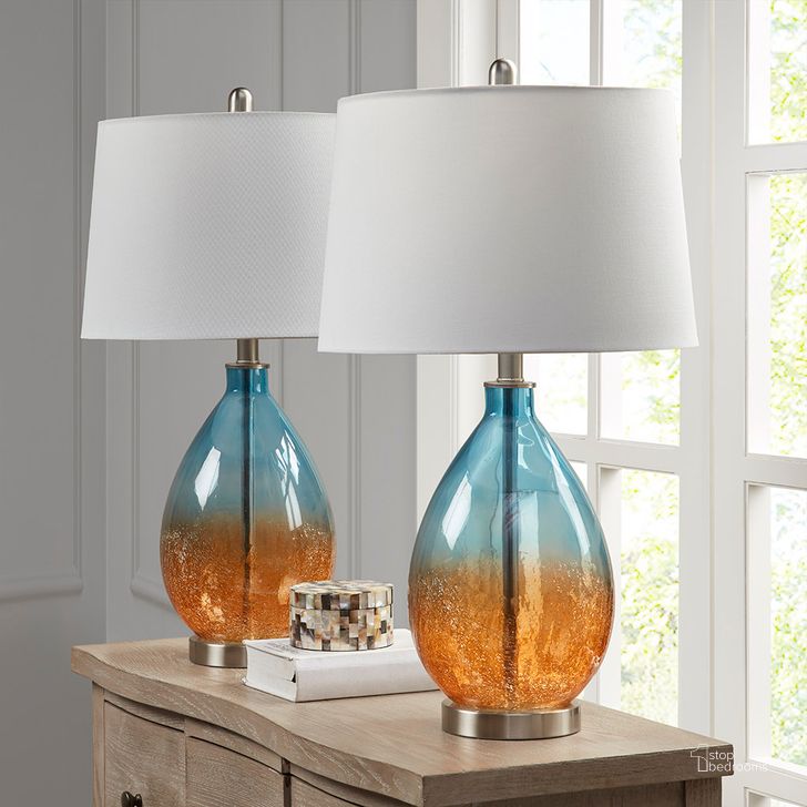 The appearance of Cortina Table Lamp Set Of 2 In Blue designed by Olliix in the transitional interior design. This blue piece of furniture  was selected by 1StopBedrooms from Cortina Collection to add a touch of cosiness and style into your home. Sku: 5DS153-0031. Material: Polyester. Product Type: Table Lamp. Image1