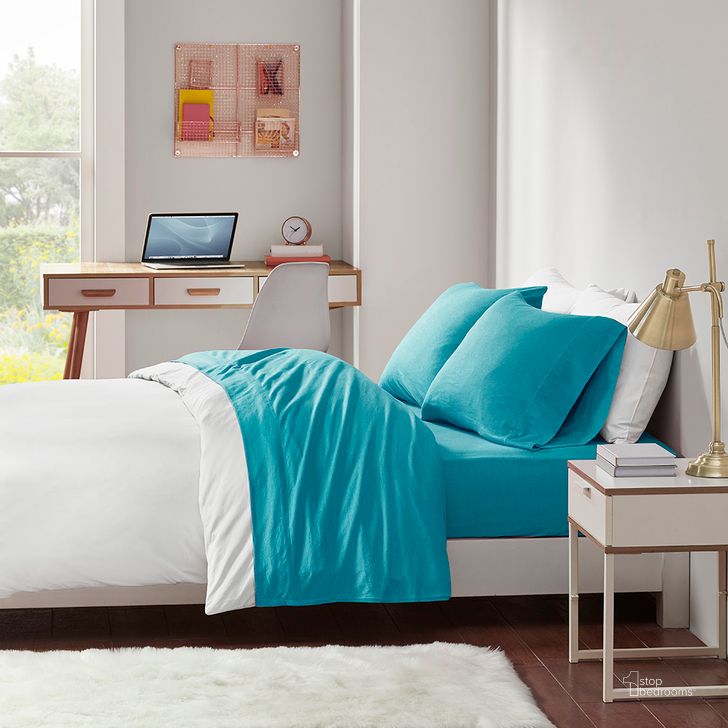 The appearance of Cotton Solid Blend Jersey Knit Twin Sheet Set In Teal designed by Olliix in the transitional interior design. This teal piece of furniture  was selected by 1StopBedrooms from Cotton Blend Jersey Knit Collection to add a touch of cosiness and style into your home. Sku: ID20-1236. Material: Polyester. Bed Size: Twin. Product Type: Bed Sheet. Image1