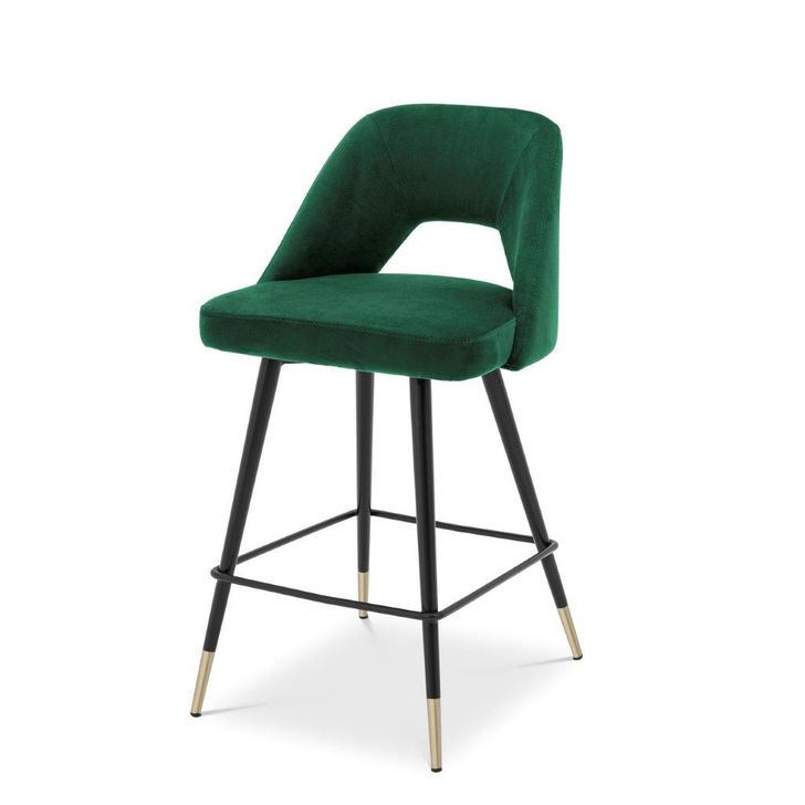 The appearance of Counter Stool In Avorio Roche Green Velvet designed by Eichholtz in the modern / contemporary interior design. This green piece of furniture  was selected by 1StopBedrooms from Avorio Collection to add a touch of cosiness and style into your home. Sku: A112055. Product Type: Barstool. Material: Velvet. Image1